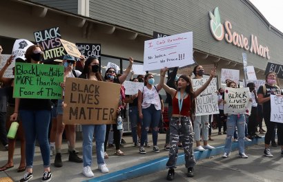The large contingent of protesters made their way to Save Mart and then returned to the downtown area.